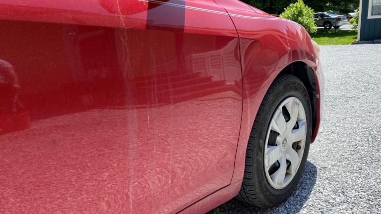 Scratched and Stained Red Car Paint